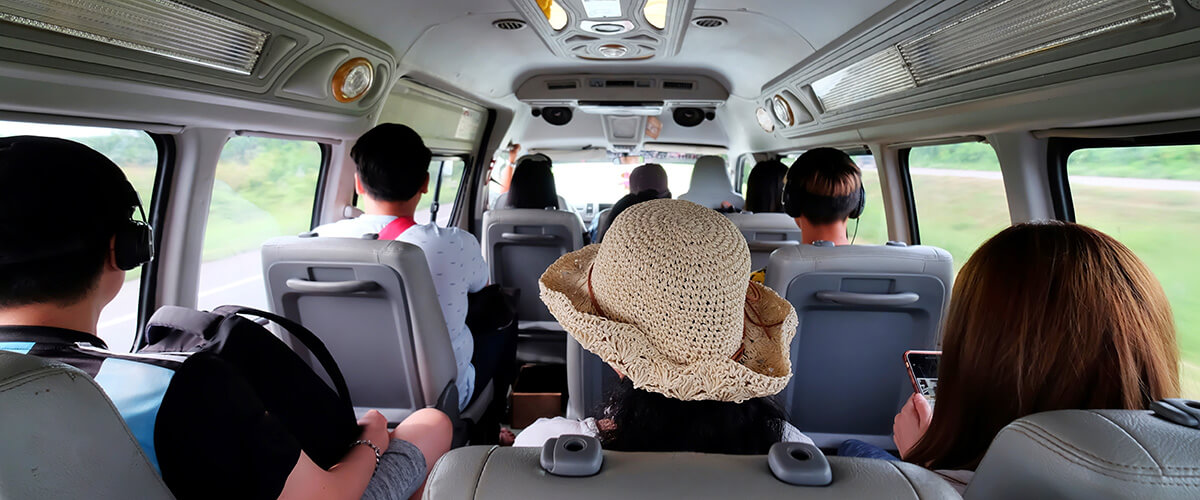 passengers inside corona bus rental on roadtrip